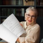 An Elderly Woman Holding a Script